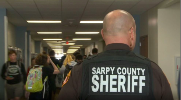 Behind the Badge: Walking the halls, Deputy Dales makes sure everyone is safe and doing what they are supposed to. He is always ready to act in case of an emergency.