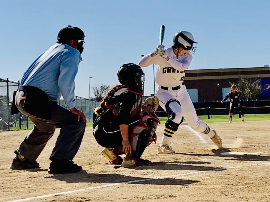 Stepping Up To The Plate: Senior taking the swing. Billie Andrews (20) gets ready for the hit as she is in her batting stance. She is seconds away from either a strike or a hit.