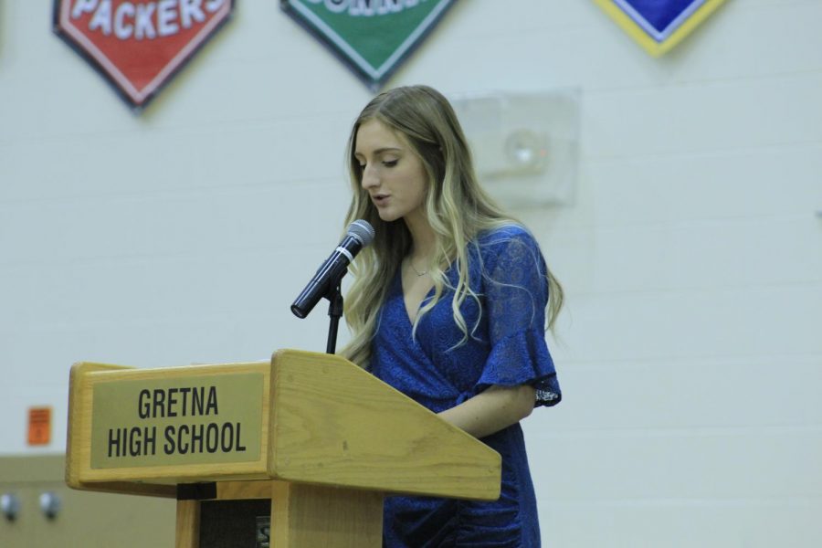 Junior Kate Zeleny speaks to the study body during the Veterans Day Assembly. 
