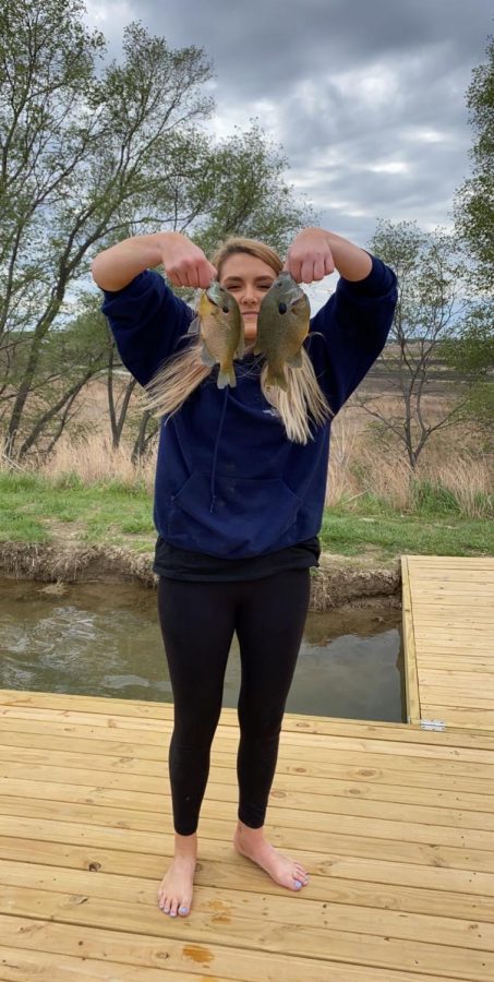 Fishing at the pond is these two girls favorite activity. Here is Piper Geise holding two fish that she had caught.