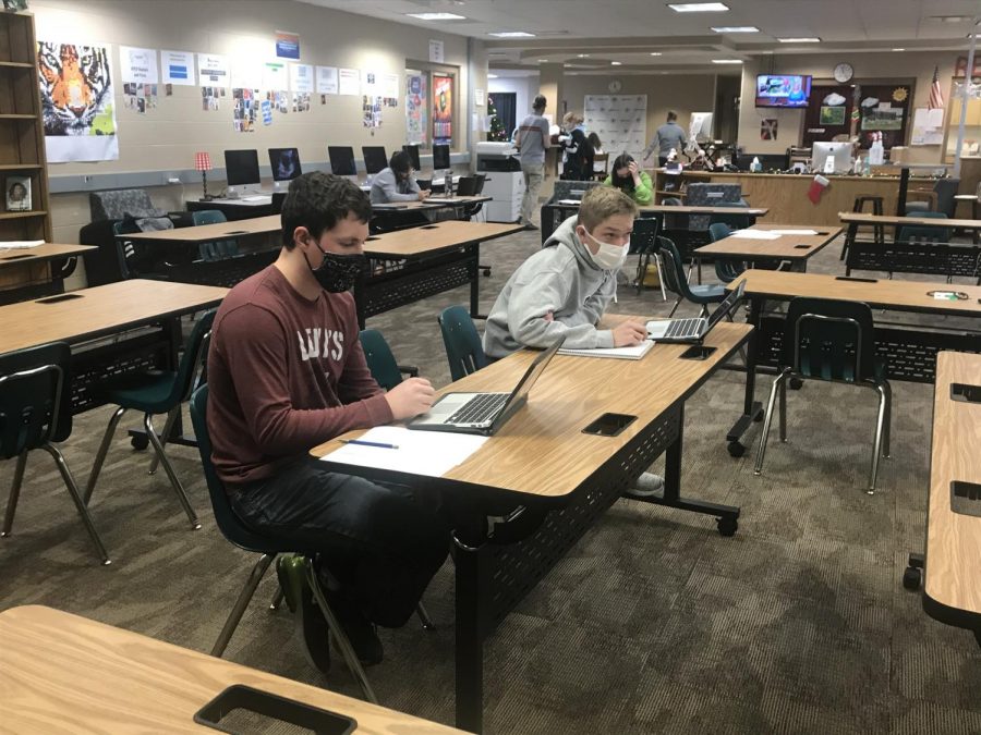 Quick Math: Looking up at the screen, Zachary Kozak (22) and Kolton O’Neal (21) wait for their next problem. “My favorite part was doing math and not being in school,” O’Neal said. They lost the match to Bellevue East.