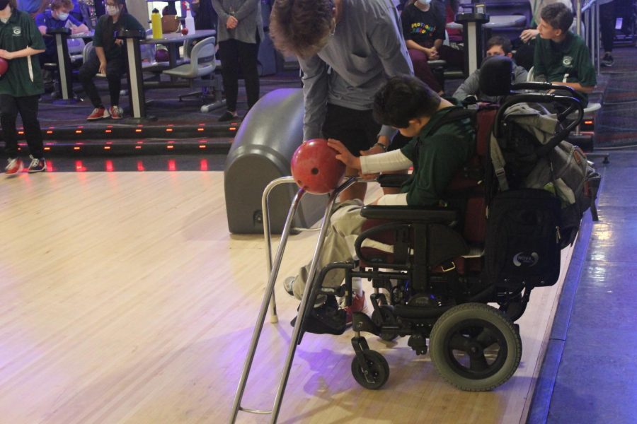 Rock and Roll: With the assistance of Paul Kramer (22), Daniel Kirchner (18) sends his ball barreling towards the pins. “I like seeing the kids, and how excited they get, and how much fun they have.” Kramer said. In addition to helping, Kramer also bowled.