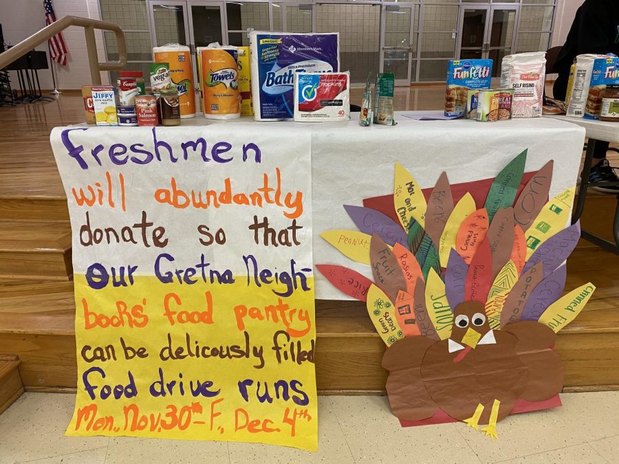 Freshman Luster: The colorful table designed by the freshman was an attempt to increase donations for the food drive. Student council does a food drive every year to help the citizens in the Gretna area, Sarah Turpen (21) said. All 23 items collected by the freshman are pictured in the photo.