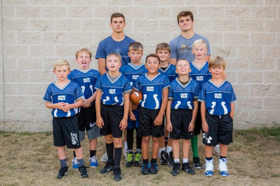 Team Pic: The team coached by Creed Leathers (21) and Tanner Hall (21) takes a funny picture. I enjoyed being a flag football coach, Leathers said. It was fun to get to know younger kids in the community. The team lost in the first round of playoffs.