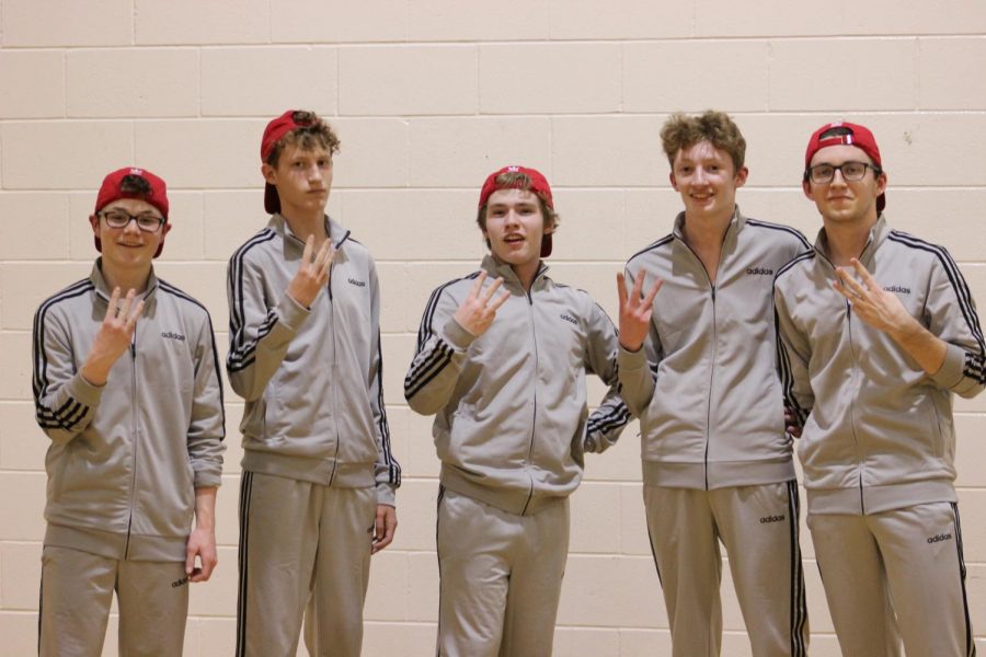 Circa 2019: Last year five boys played an entire game in jumpsuits. I really enjoyed doing intramurals, junior Simon Kerr said. It was a lot of fun playing with friends Im kind of bummed that we dont get to do that this year.  I like spending time after school with them and it was fun to just play basketball again. Kerr is pictured without a red hat.
