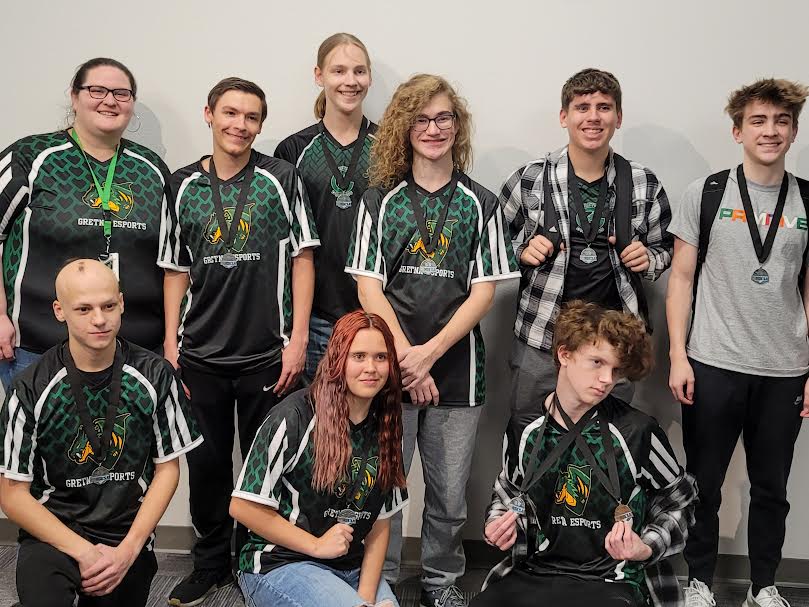 State+Smiles%3A+With+jerseys+on+and+medals+around+their+necks%2C+the+team+smiles+after+the+state+competition.+we+are+very+fortunate+to+have+several+good+esports+teams%2C+esports+coach+Kimberly+Ingraham-Beck+said.+This+year+the+varsity+team+placed+second%2C+which+im+very+happy+about.+The+team+performed+better+than+last+year+as+well+as+improved+their+skills+as+a+whole.
