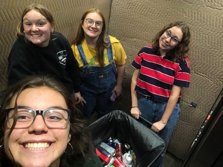 Collecting Cans: Juniors Lillian Hydeen, Addy Slusher, Kiera Morgan and Kathryn Johnson in AEP were collecting cans from the classrooms. Each classroom has a bin that students can put their aluminum cans in. Collecting cans is only one of the activities the the Green for Gretna club does.