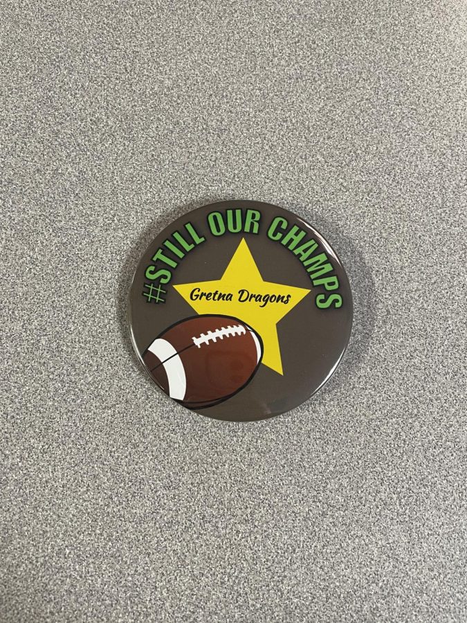 Still our champs! Buttons were given to all of the teachers at GHS to show support for the varsity football team. Although the title was taken and the games were forfeited, the community stands behind the hard work fo the football players.