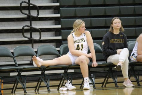 Team Player. A torn ligament forces Addi Armitage (25) to cheer for her teammates from the bench. Armitage tore 2 ligaments in her foot  in the game against Omaha Central on January 27 2022. This injury ended her freshman season.