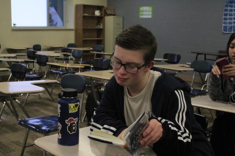 Students who have all their assignments in are allowed to have free time or green zone for first-period algebra. Tregan Crister (25) takes this time to read and get his AR done for the next class, English.