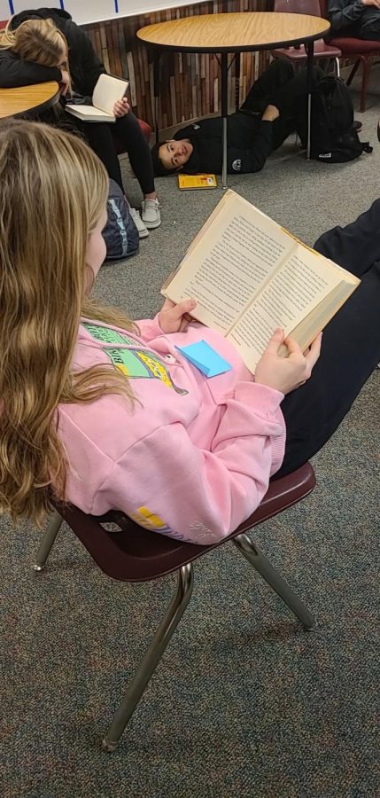 Meeting goals. Each freshmen English student is given a goal to meet. Anniston Trevarrow (25) sits back and relaxes while reading her AR book to meet her quarterly point goal.