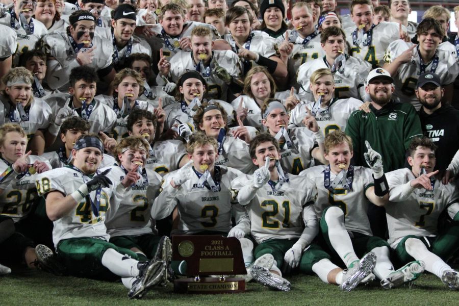 Number one! The football team pose and smile for a picture to celebrate their win against the Westside Warriors after the game at Memorial stadium. It was
reported that Gretna fans beat the record for the most fans at a state championship game.