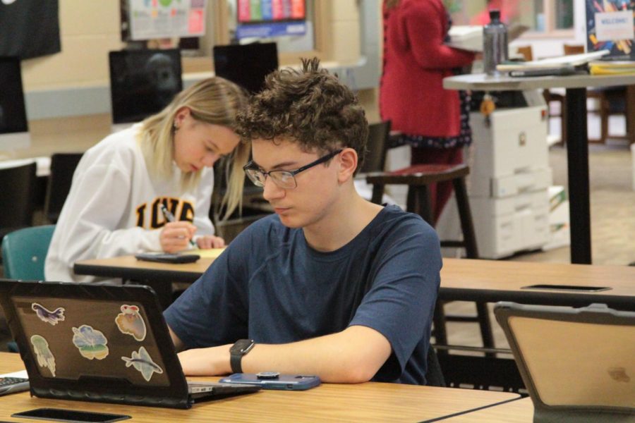 WORKING+HARD+-+Student+Austin+Boettger+%2823%29+goes+to+the+math+center+to+work+on+his+homework.+The+students+can+work+on+various+things+while+they+are+at+the+center.+%E2%80%9CWhen+we+do+reassessment+in+the+math+department+it+also+provides+some+extra+support+to+make+sure+that+they+have+learned+from+any+mistakes+they%E2%80%99ve+made+previously%2C%E2%80%9D+Math+teacher+Ryan+Garder+said.