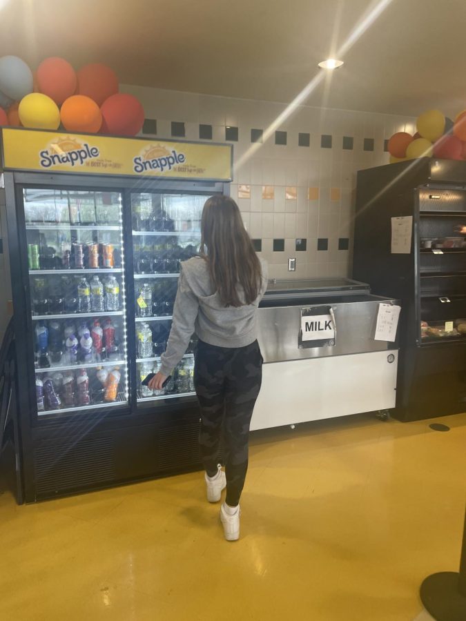 Grab a Snack! On her way to purchase a drink Ellie Melton (25) visits the “Drag N Go” cafe. The fridge was stocked with plenty of options to ensure students had enough options to curb their hunger.