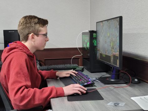 GAMING ALL DAY - Freshman Connor Hutchinson plays one of the single player games in a match, He is playing hard to try to win. The game he is playing is all about strategy, Conner has to strategize to get the win. “Single player games make you think about what to do next and think ahead before placing your next move,” sophomore Owen Arneson said.