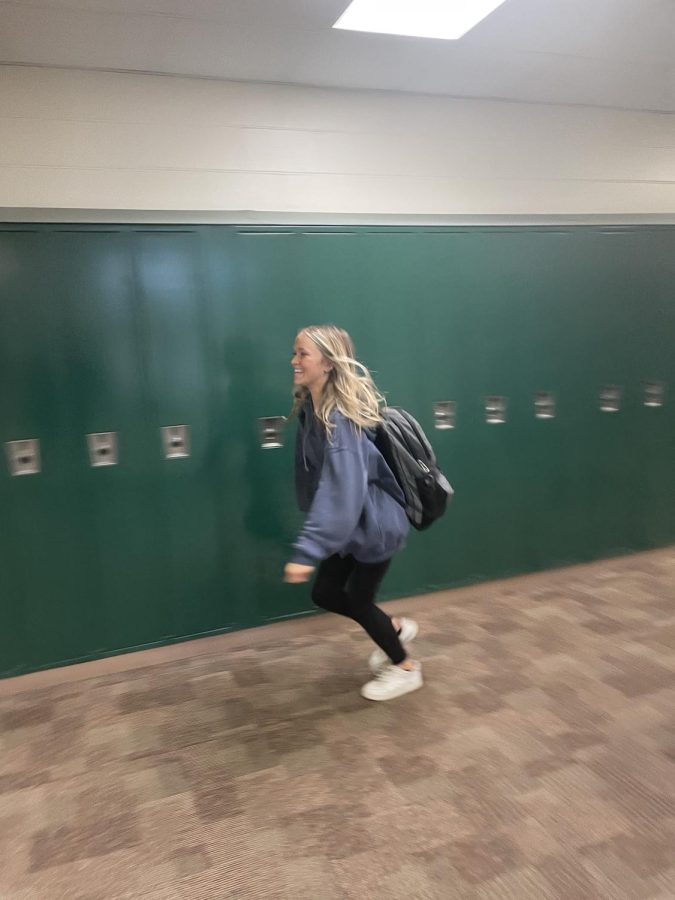 On the Run! Sabrina Andrews (25) runs down the hallway to escape being tagged. She was forced to take a different route to class to avoid being tagged.