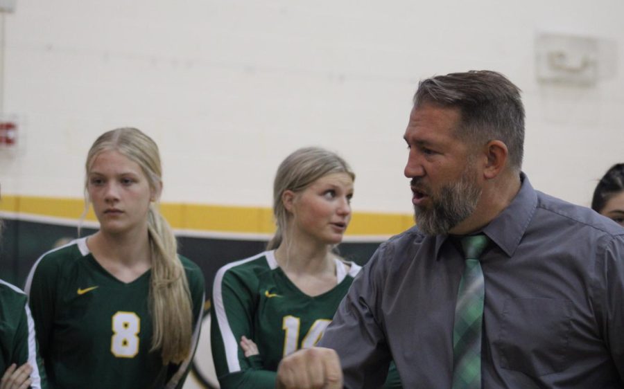 Coach Mike Brandon gives the GHS volleyball team a pep-talk during a timeout.
