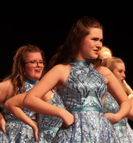 Alli Miller (25), Katie Lilla (25) and Madi Davenport (26) perform at Glenwood High School last month.
