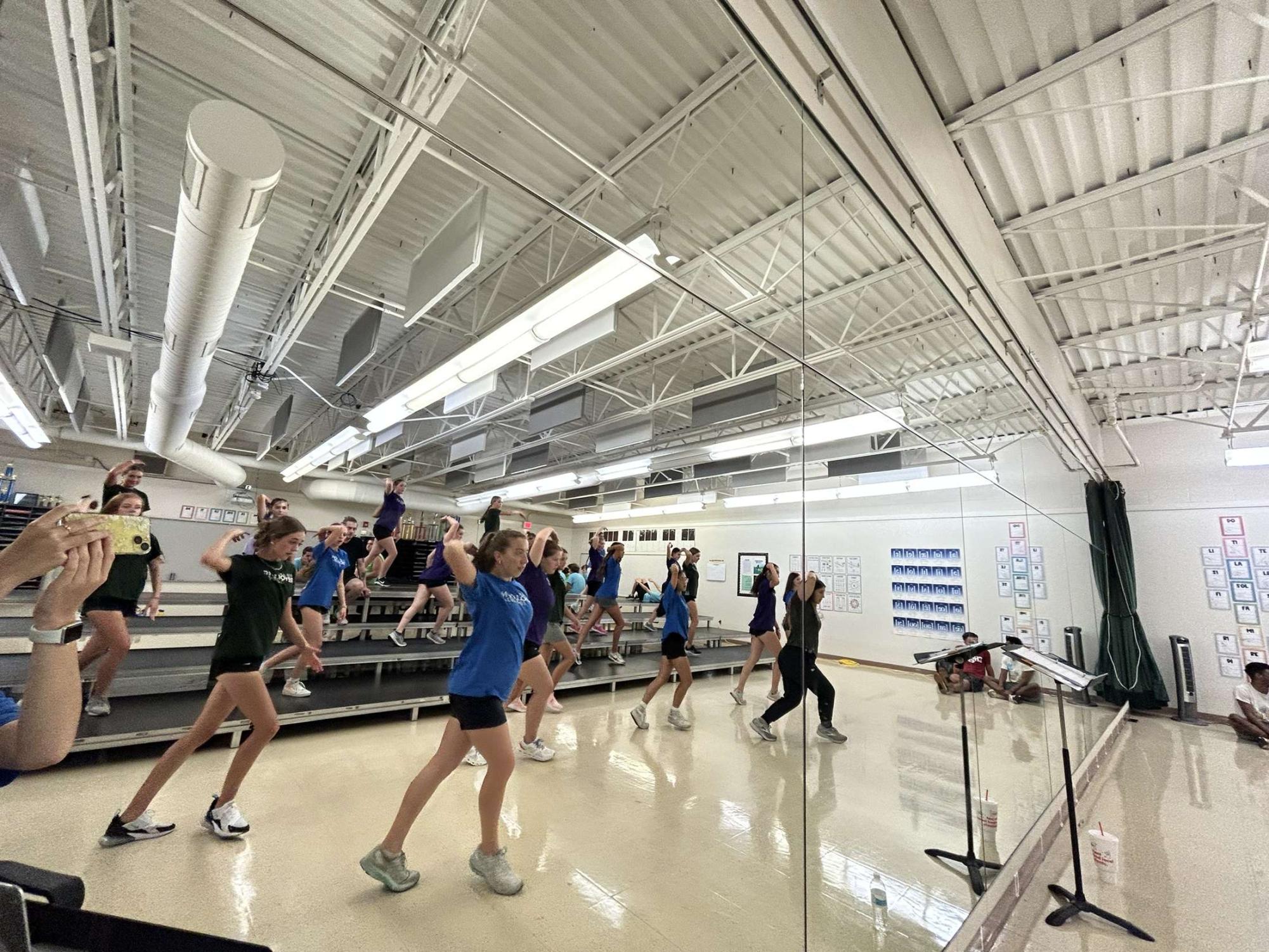 Revolution learns choreography at a recent session. Even though the season does not start until January, the group began training before the school year started. 