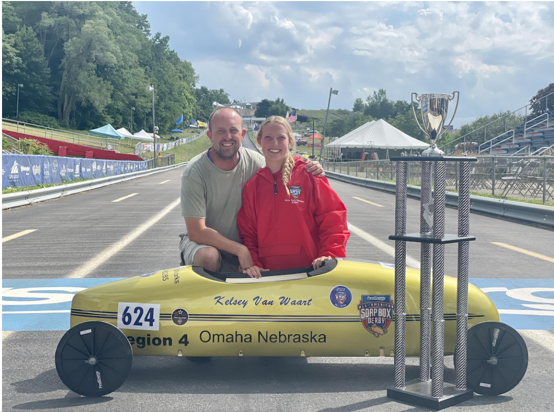 Kelsey Van Waart (26) and her dad after winning the Soap Box Derby world championship this past year.