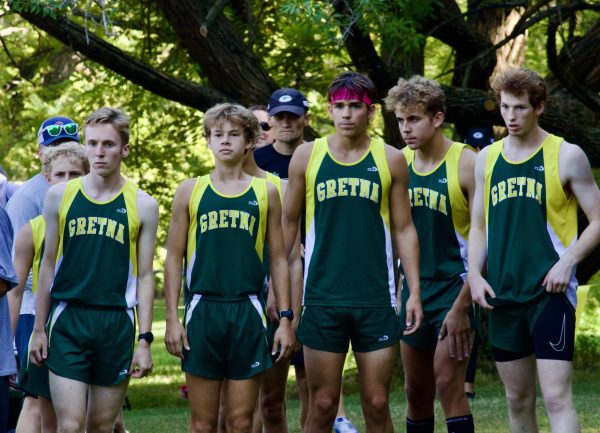 The boys varsity cross country runners line up to start at Walnut Grove.  Burke High School hosted the event. 