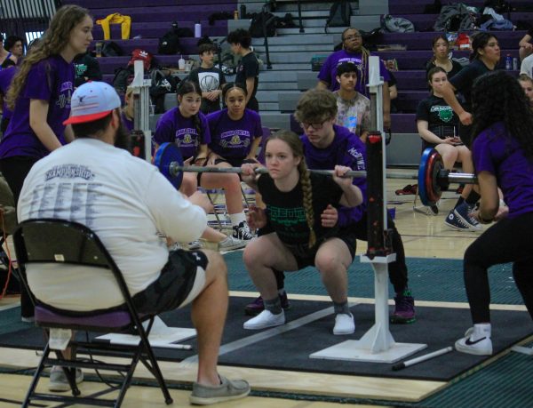 Sophomore Emma Hermeling competes in the squat event at a meet last season. The power lifting team hopes to build on last years success starting this semester. 