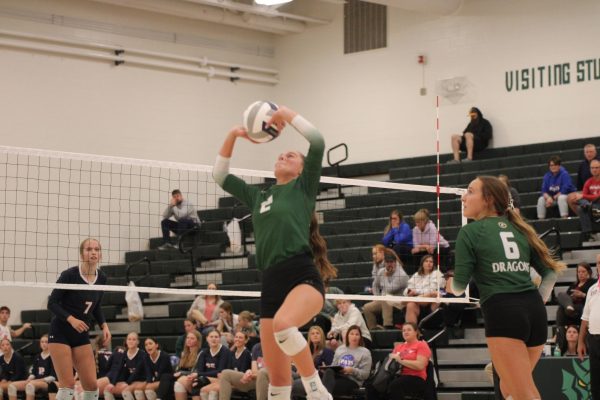 Avery Fotopolos (24) sets the ball to her teammate.