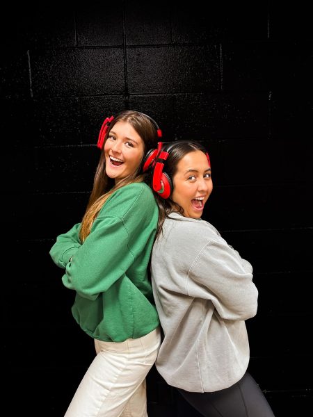 Editor-in-Chiefs Karleigh North and Ava Fuller pose back to back. 