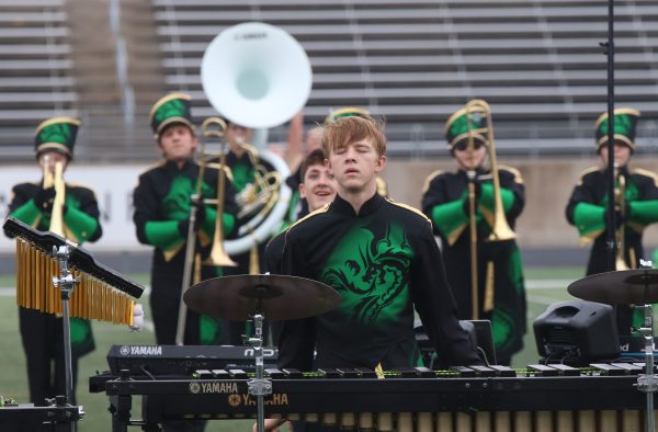 Elijah Wombacher (11) plays percussion with the marching band. Marching band ends in the fall. The band program has eight different musical groups.