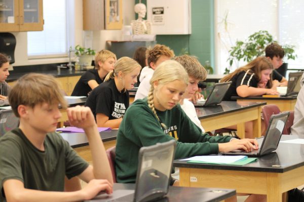 Freshman Audra Blessen (center) concentrates on her work in Biology. Blessen also plays softball and is in shown choir. 