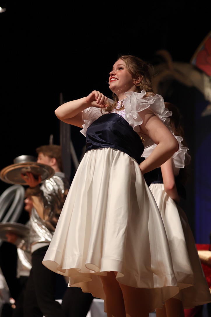 Senior Julia Lewis dancing during the song Be Our Guest. 
