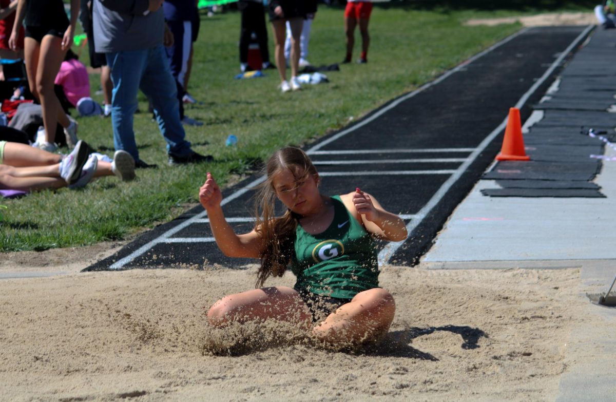 Brynne Hoellen (24) makes a Triple Jump attempt at the A-1 District Track Meet on May 7. She placed 15th overall with 31 1.75.