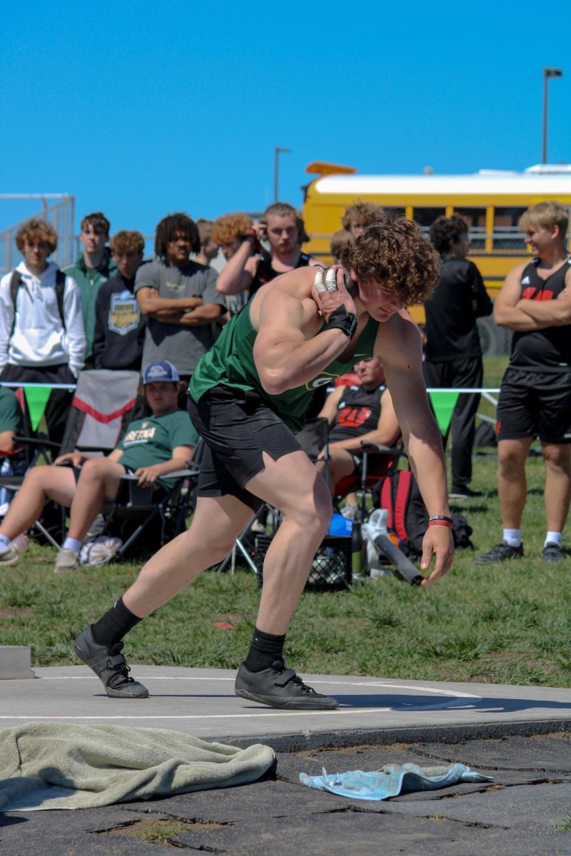 Blake Hawkins (24) is preparing to throw in the shot put event at the A-1 District Track meet on May 7. He placed fourth overall with a throw of 49 1.