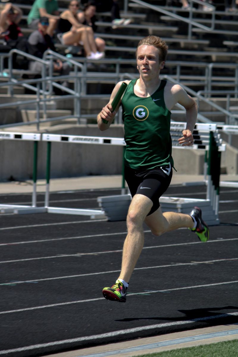 Gavin Luthi (25) runs in the boys 4x800m relay at the A-1 District Track Meet on May 7. They placed fifth with a time of 8:20.62.
