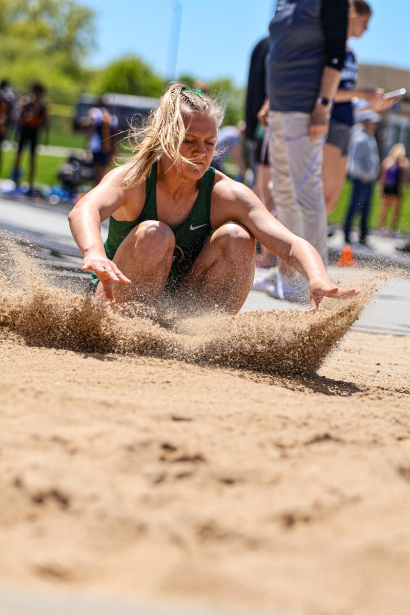 Addison Dostal (24) lands her last jump during Long Jump Finals. Dostal placed 8th overall in the event.
