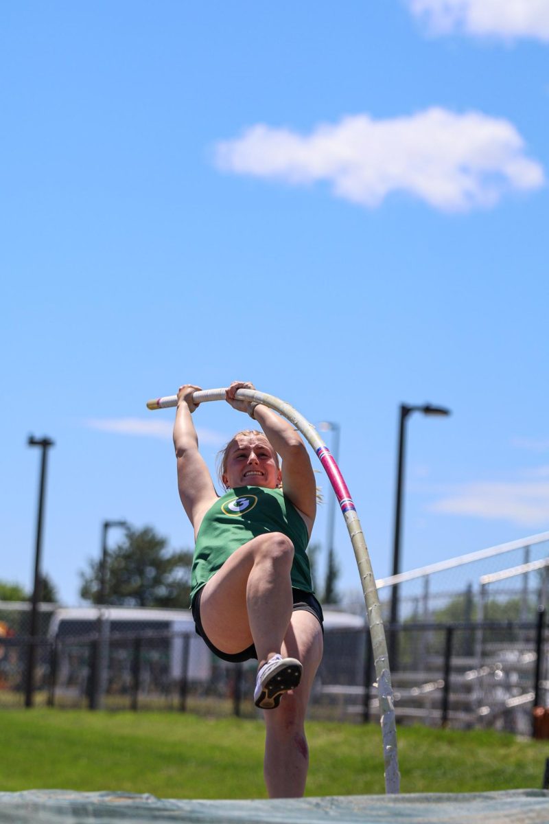 Using her upper body strength, Miaya Speer (24) pushes herself off of her pole. Speer placed second overall with the height of 106.