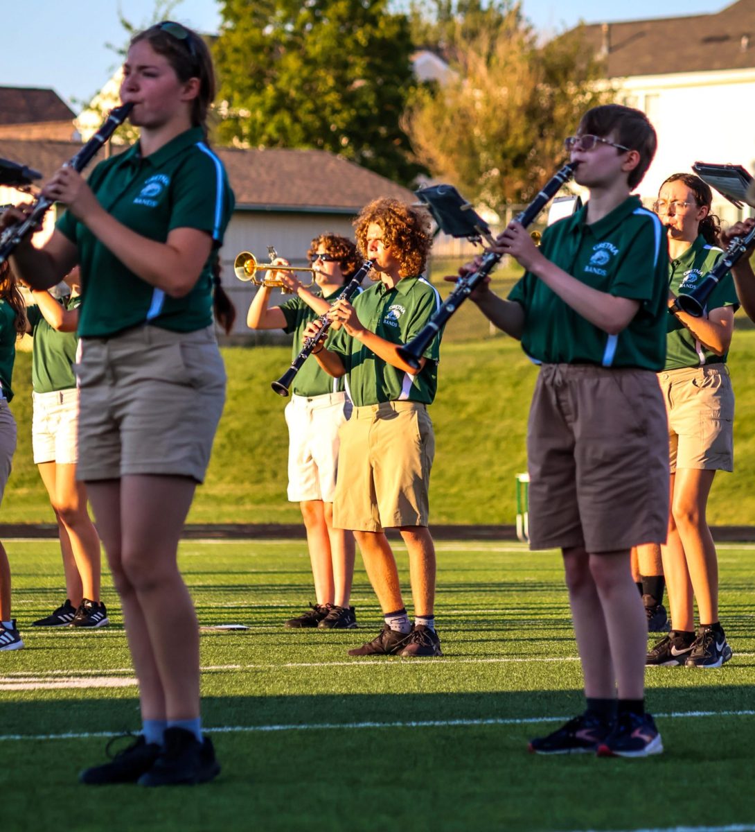 Clarinet players Kailyn Nakai (27) Drake Ruggles (27) and Arya Thompson (27) march in place on the GHS football field. They performed their show for this year, "Gusto Italiano: A Taste of Italy," at their expo on August 6.