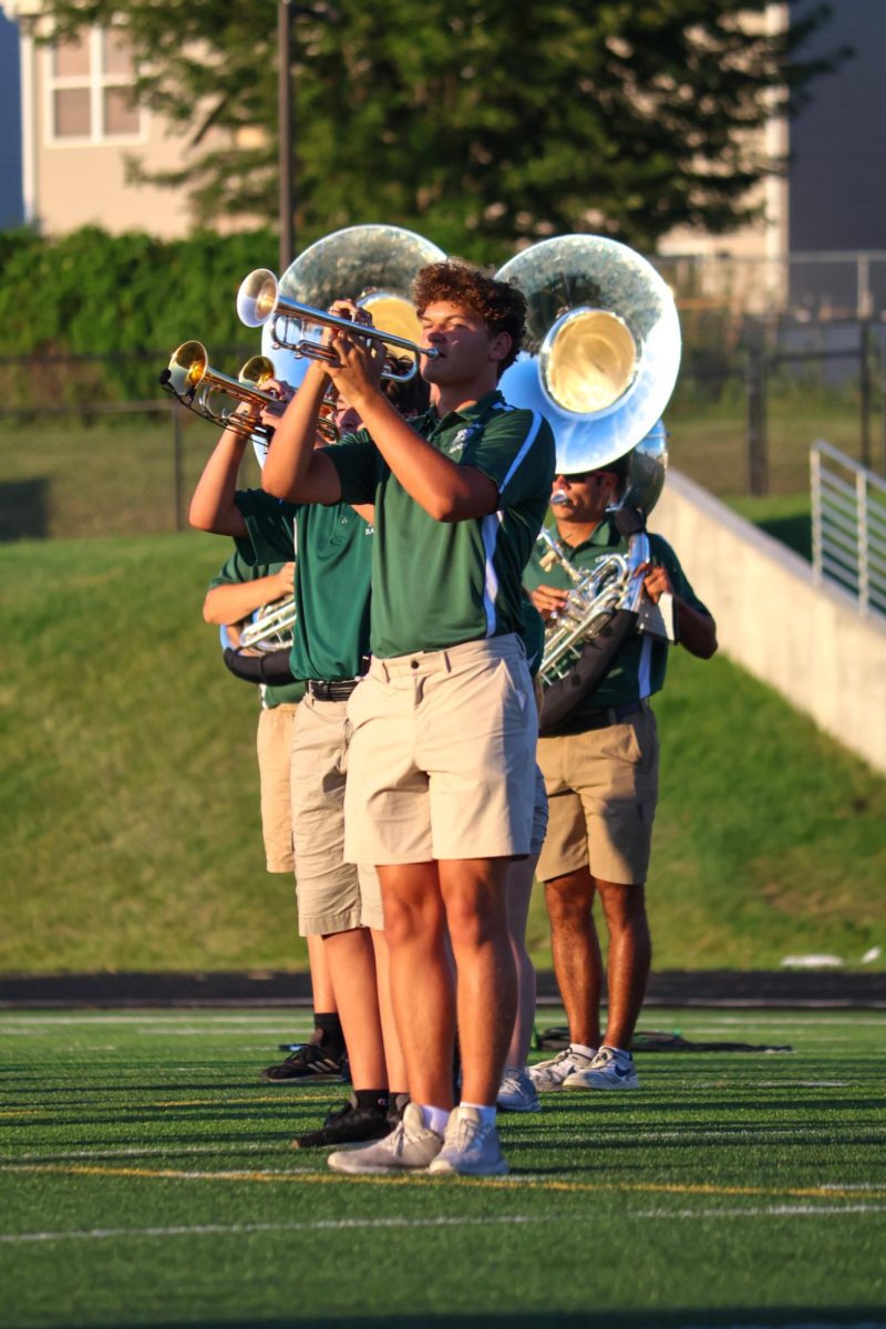 Carson Wheeler (25) plays the trumpet alongside other members of the GHS Marching Band. They performed their show for this year, "Gusto Italiano: A Taste of Italy," at their expo on August 6.