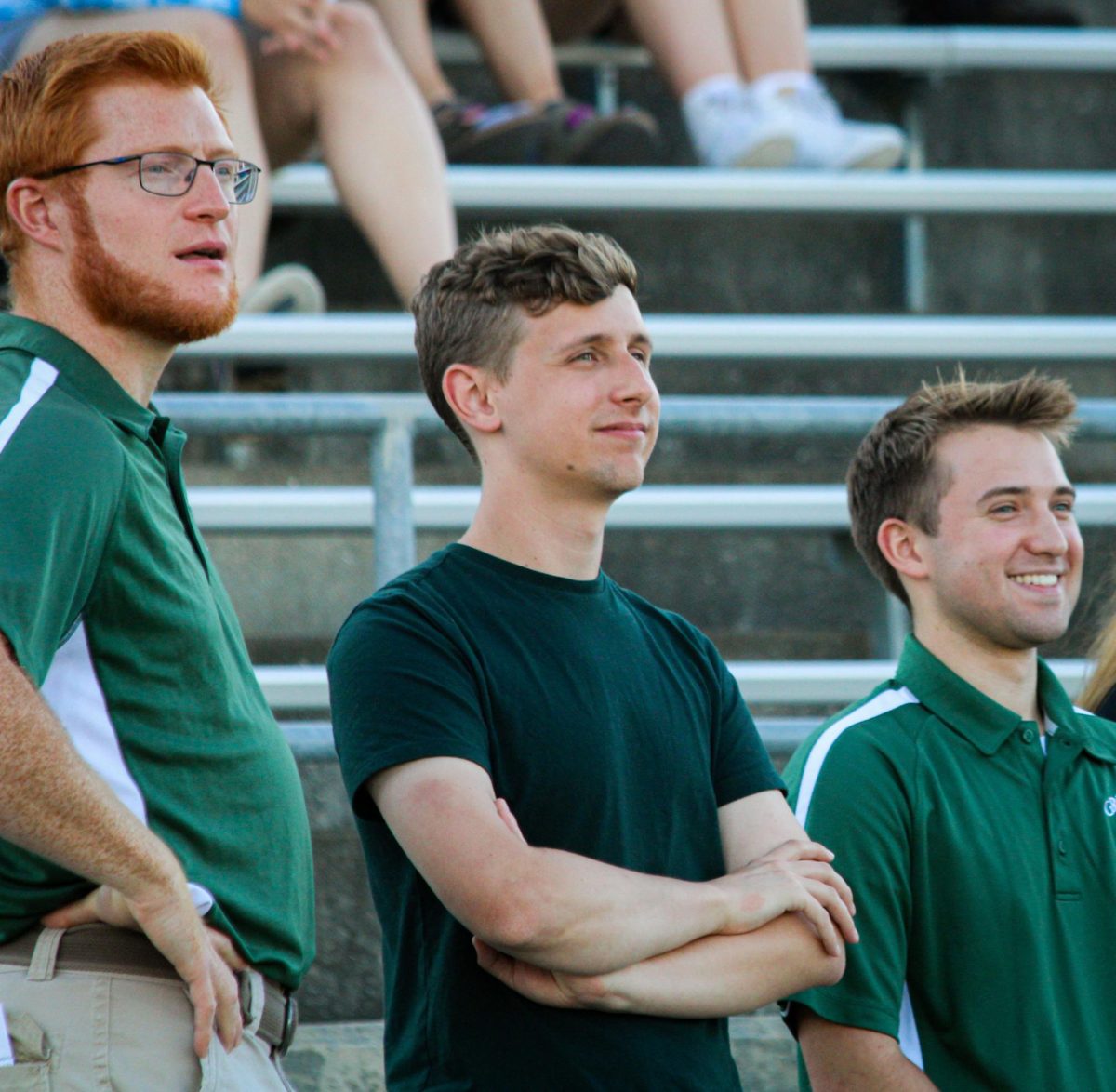 Band director Alexander Woodside, ? and Tanner Maas look on as the GHS marching band perform for friends and family after their week-long camp. They performed their show for this year, "Gusto Italiano: A Taste of Italy," at their expo on August 6.