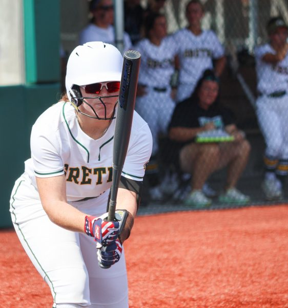 Catcher Carlie Muhlbach (25) focuses in on her bat to prepare herself to get back in the box at the Gretna vs. Omaha Marian scrimmage on Aug. 17.