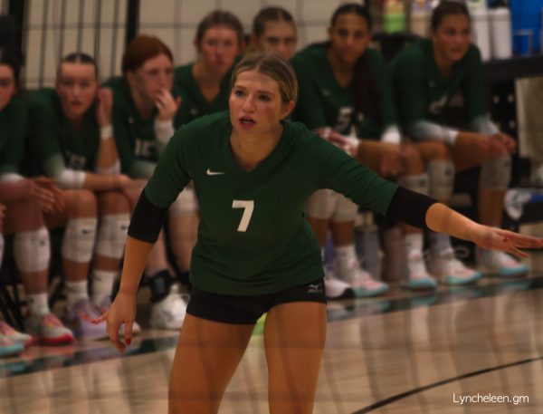 Senior Elle Heckenlively talks to her teammates before the play.