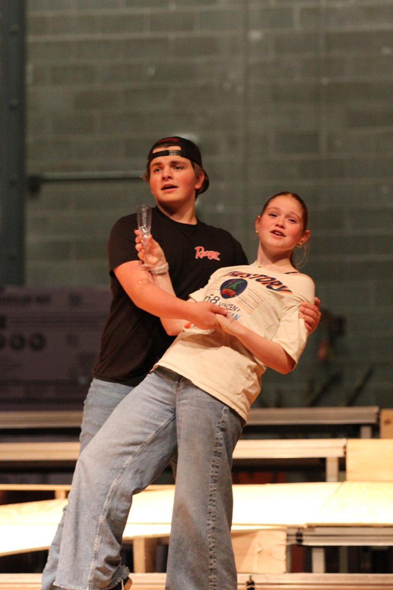 Senior Clayton Angland dips junior Roxy Lightly during their dance. 
