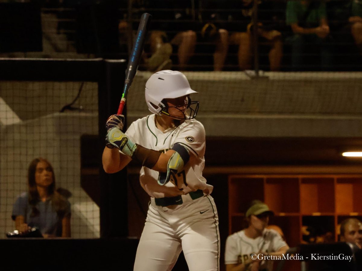 Senior Carlie Muhlbach prepares to hit at the home plate. Muhlbach will be playing softball for the University of Nebraska Lincoln next year.