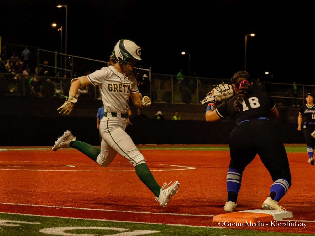 Senior Anniston Trevarrow sprints towards first base during the Class A championship game.