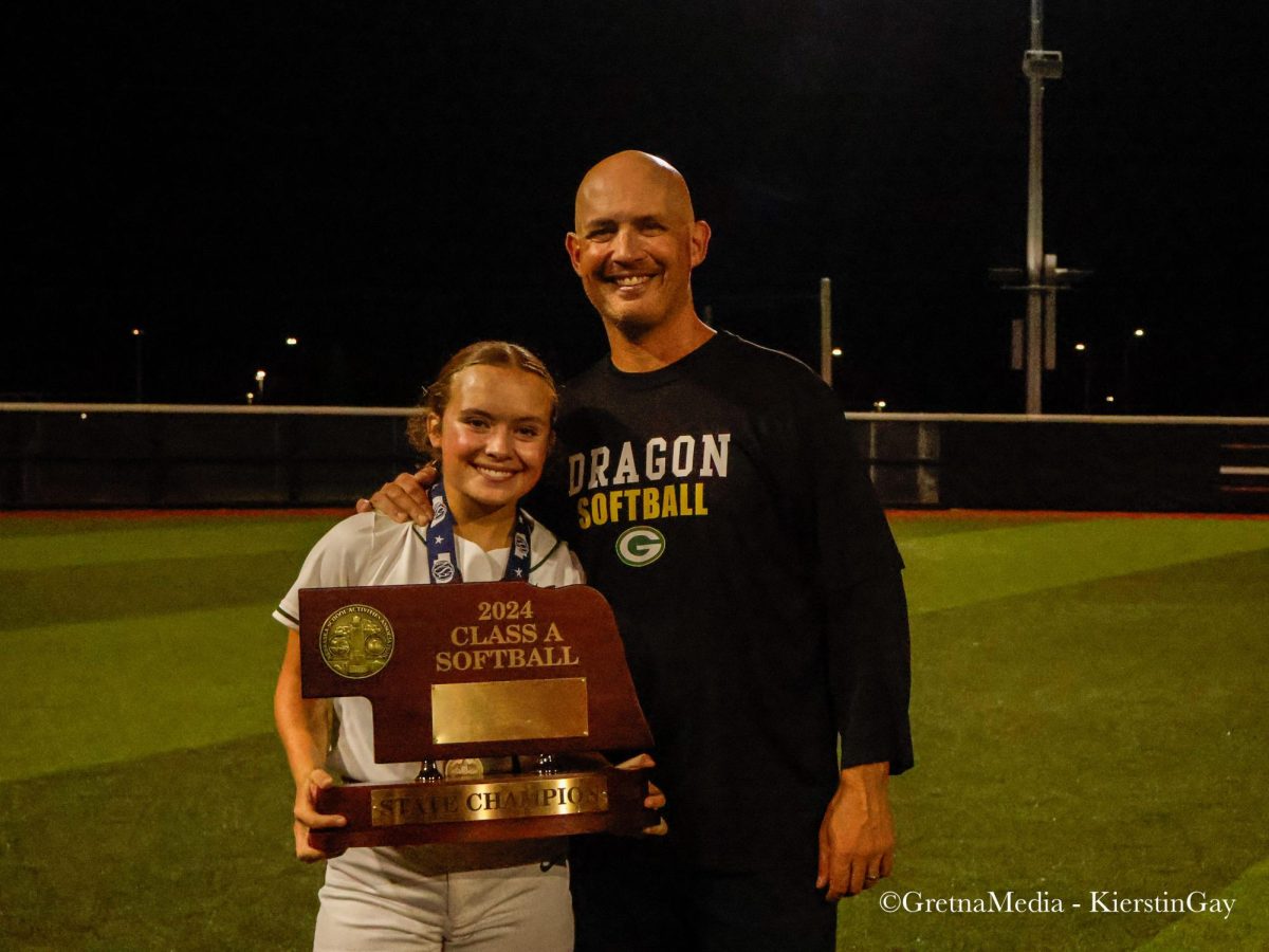 A father, Head Coach Bill Heard, and daughter, junior Brylee Heard, duo pose for a picture with the Class A State trophy.