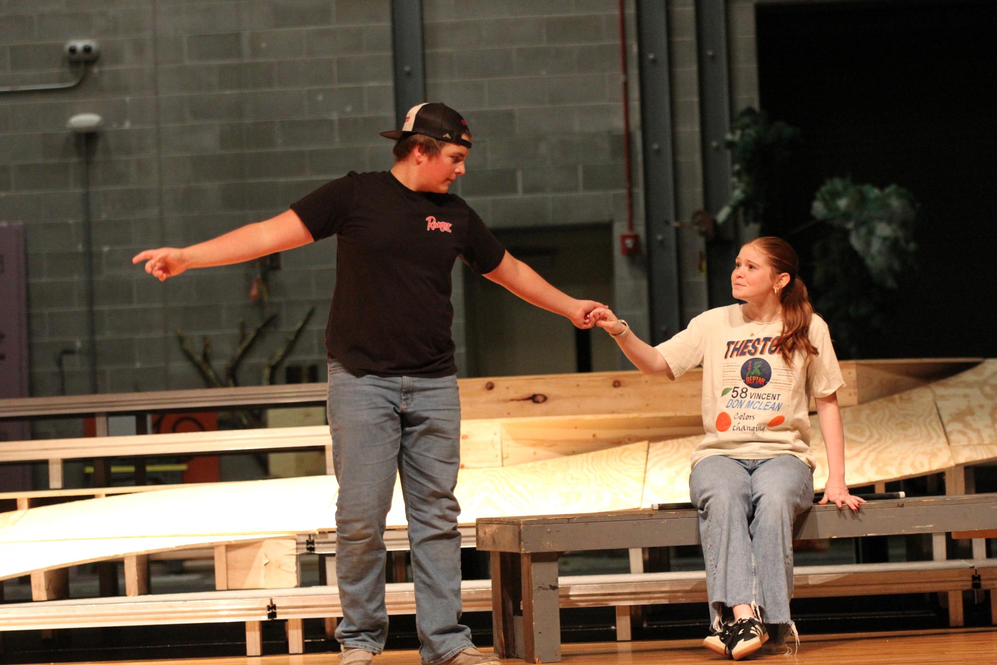 Senior Clayton Angland's character Aldolpho reaches for the hand of junior Roxy Lightle's character Drowsy during rehearsal in the GHS theater. "I'm excited to have a comedy. I'm just excited to hear people laugh and make people laugh," said Lightle.
