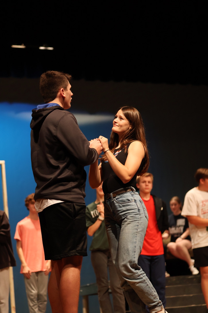 Junior Rebecca Roberts holds sophomore Peyton Hammond's hand before she parts from him to prepare for the upcoming wedding. 