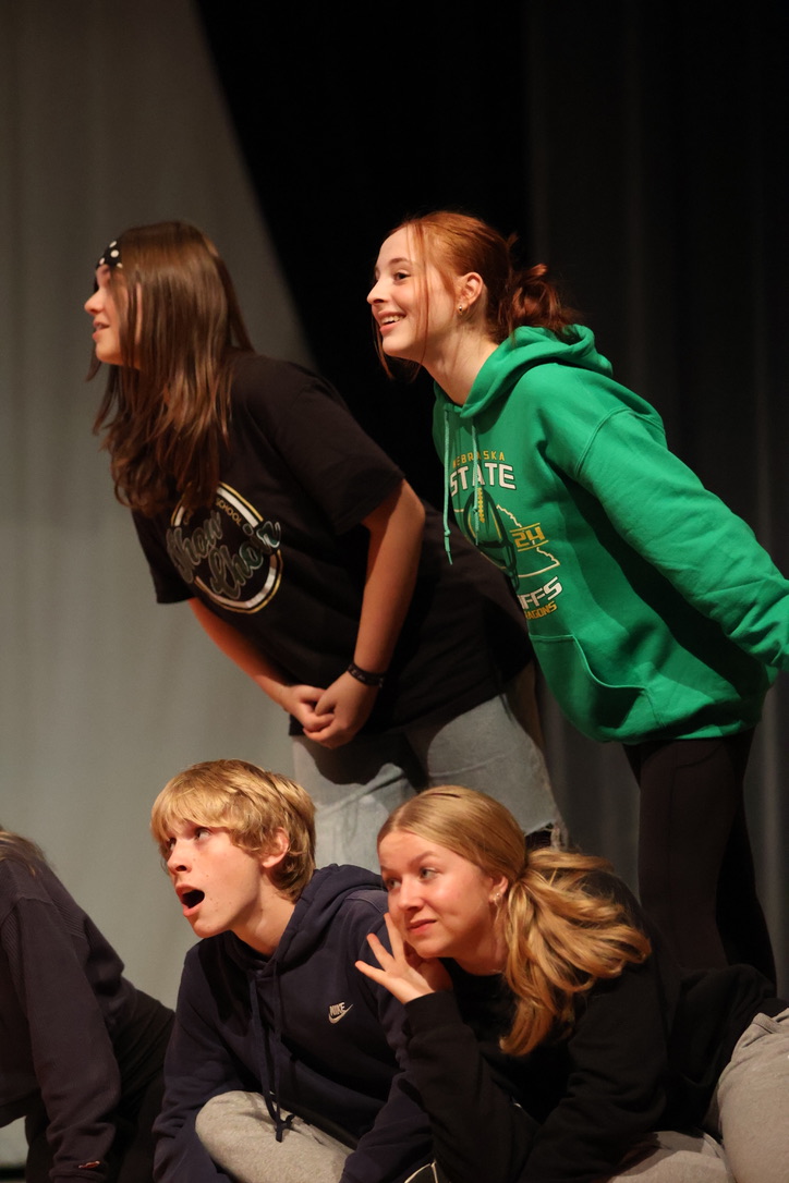 Freshmen Paisley Christofferson, Miah Lindquist, Jaden Bumgardner and Tatum Wright eavesdrop sneakily into the conversation occuring. 