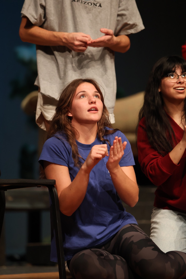 Sophomore Elizabeth Wegner looks admiringly at the former show girl and writes down quotes. 