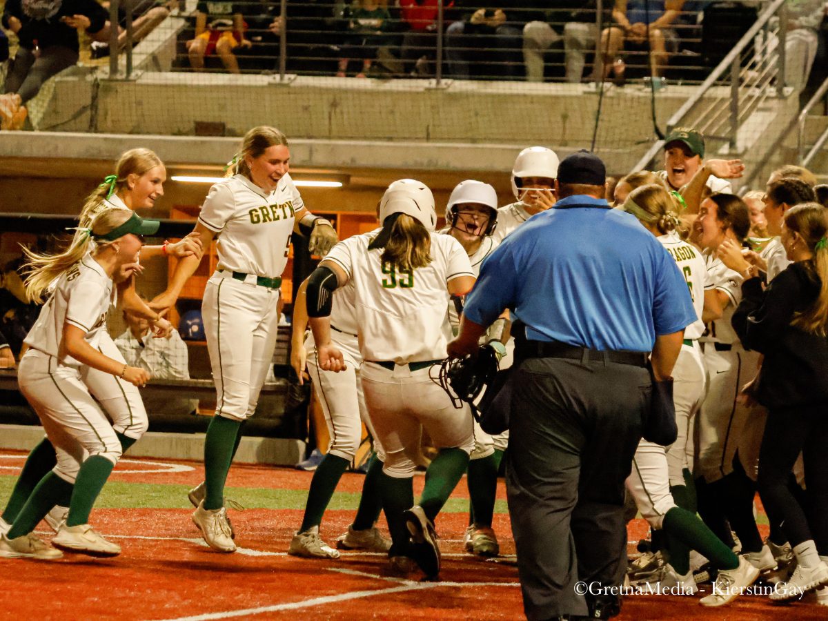 Senior Alexis Jensen stomps on home plate to end the Class A State Championship Final 8-0 over Millard North. “It feels amazing to be on this team,” Jensen said. “Especially since we all knew we were the best team in the nation.” The Dragons finished the year 38-0.